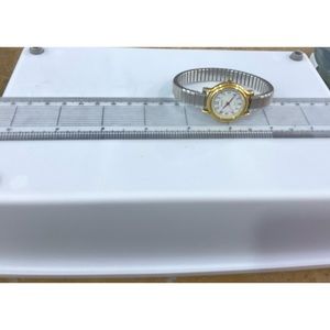 Geneva watch. Gold accents Metal spring band. Good condition